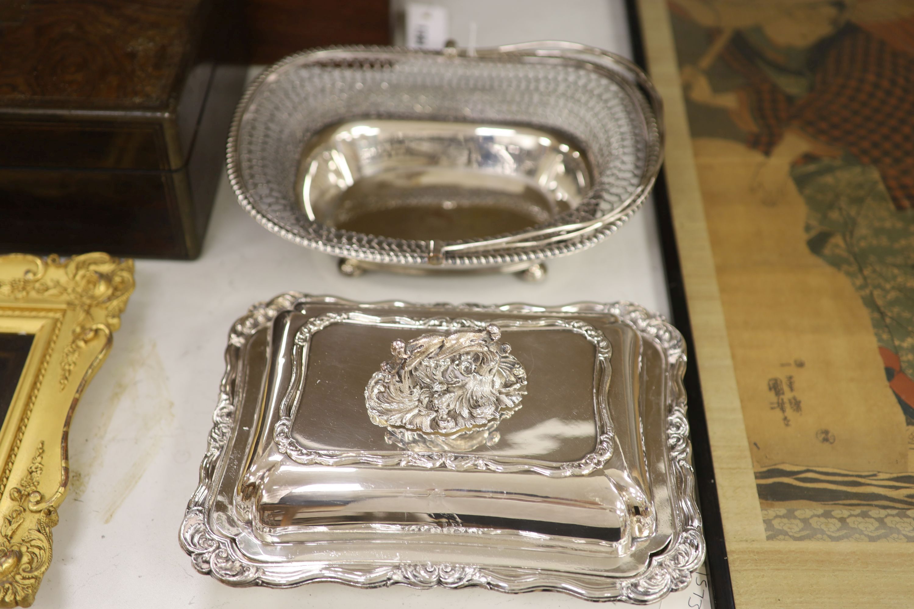 A 19th century Old Sheffield plate cake basket, an entree dish and cover, a pair of candlesticks and a wine cooler
